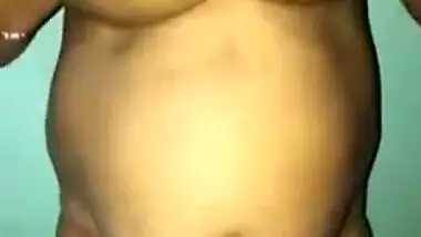 Desi woman with sexy fat tummy and big tits spreads pussy in XXX video