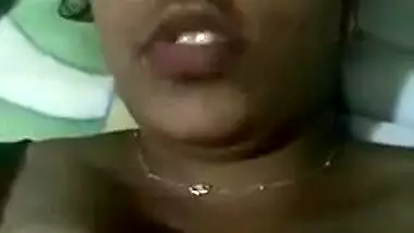 Indian aunty with sexy full lips takes big natural boobs out in bed