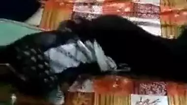 Indian girl lies in the bed but man wants to film a porn movie about her