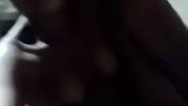 Naked Desi with dark skin does XXX porn on her own in the dark room