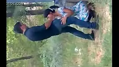 records a young couple enjoying oral sex behind their house