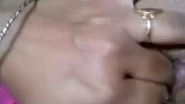 Desi bitch pulls pink dress up to XXX finger her wet hairy pussy