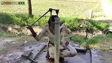 Young village school girl taking a bath in a sari and caught on camera