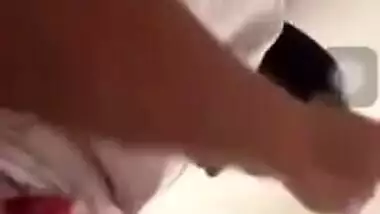 Girl performs XXX show and pulls up white T-shirt to expose boobs