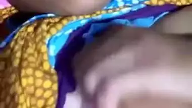 Pretty Desi MILF poses for the camera and teases with big XXX tits