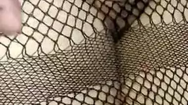 Hot Desi babe in fishnet dress has her pussy XXX rubbed by lover
