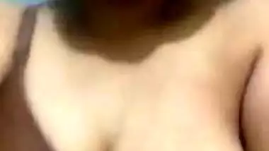 Pleasant Indian girl squeezes left breast and it also can be called porn