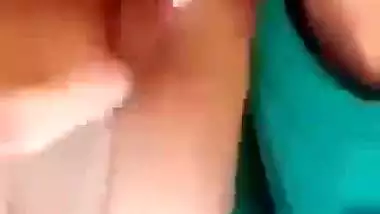 Horny girl squeezes her boobs and fingers her hairy pussy