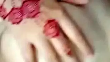 Desi female with tattooed hands receives pleasure touching chest