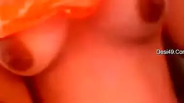 Indian babe in orange takes clothes off to flaunt boobs and buttocks