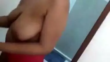 Desi woman puts on clothes in front of cameraman filming porn video