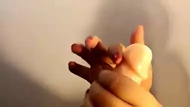 Sensual Indian MILF creams her porn toy and shoves it into the twat