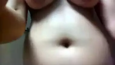 Indian girl records porn clip in which she touches own saggy tits