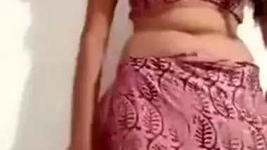 Pleasant Desi girl takes off pink dress in her first porn video