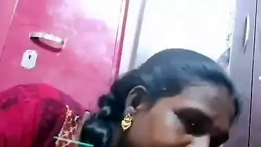 Mature tattooed Tamil wife giving handjob to husband