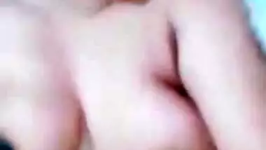 Lovely Desi with bright-red lipstick lies in bed with naked XXX parts