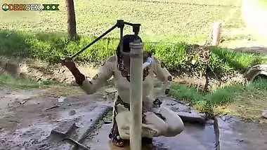 Young village school girl taking a bath in a sari and caught on camera