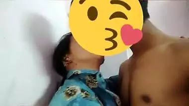 Desi girl in floral shirt kisses porn partner being covered with a smile