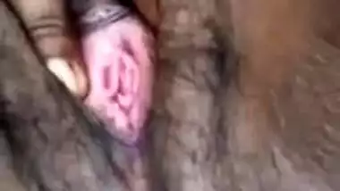 Young village girl spreads legs to rub virgin Desi bush in XXX video