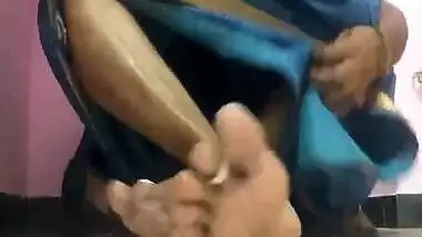 Amateur porn video where Desi MILF lifts blue dress to play with pussy