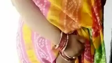 Woman in a colored dress teases Desi guys revealing big breast