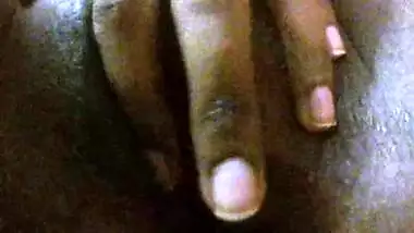 Indian girl with dark skin spreads XXX pussy in front of the camera