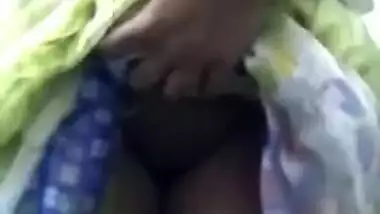 Desi chick in a colorful sari exposes tits and rubs XXX nipples