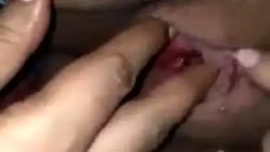 Indian woman touches her pink vagina with two hands in close-up porn
