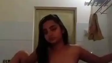 Indian nude MMS of an 18-year-old girl fingering in a bathroom