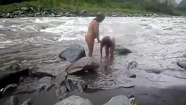 Two fat Desi women show their XXX assets while relaxing naked in river