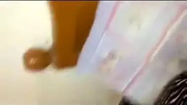 A desi aunty strips to seduce her lover in a Tamil aunty sex video