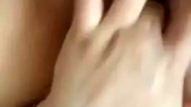 Naked Indian holds camera with one hand and fingers XXX hole with another