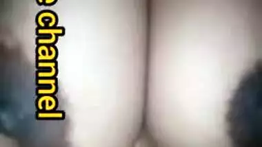 Naughty Desi woman squeezes tits to lick nipples in the porn video